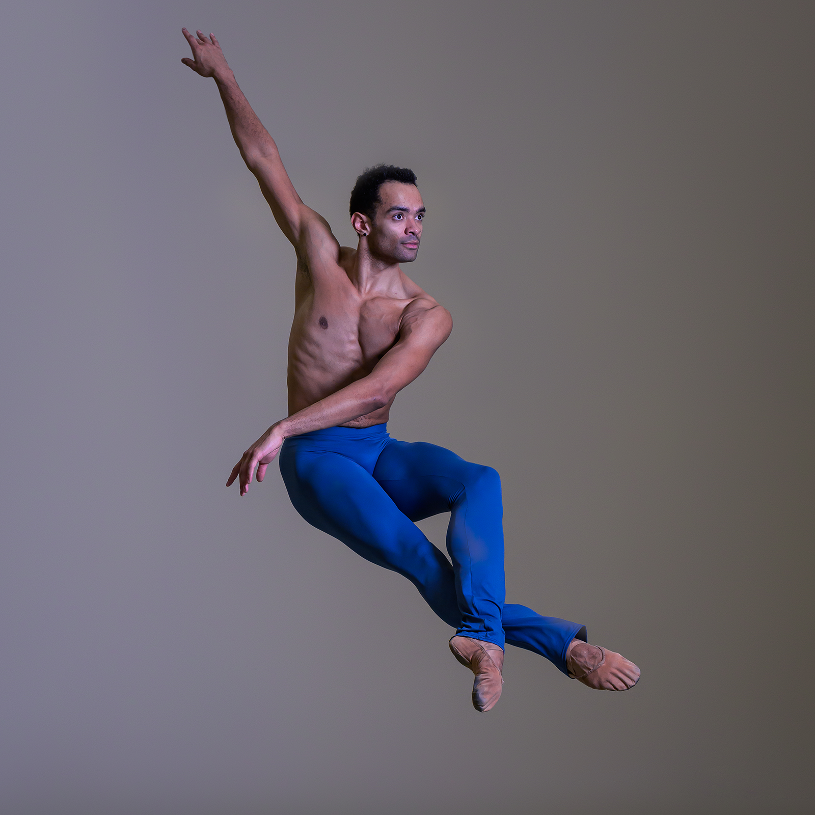 Brandon Lawrence in blue leggings leaping
