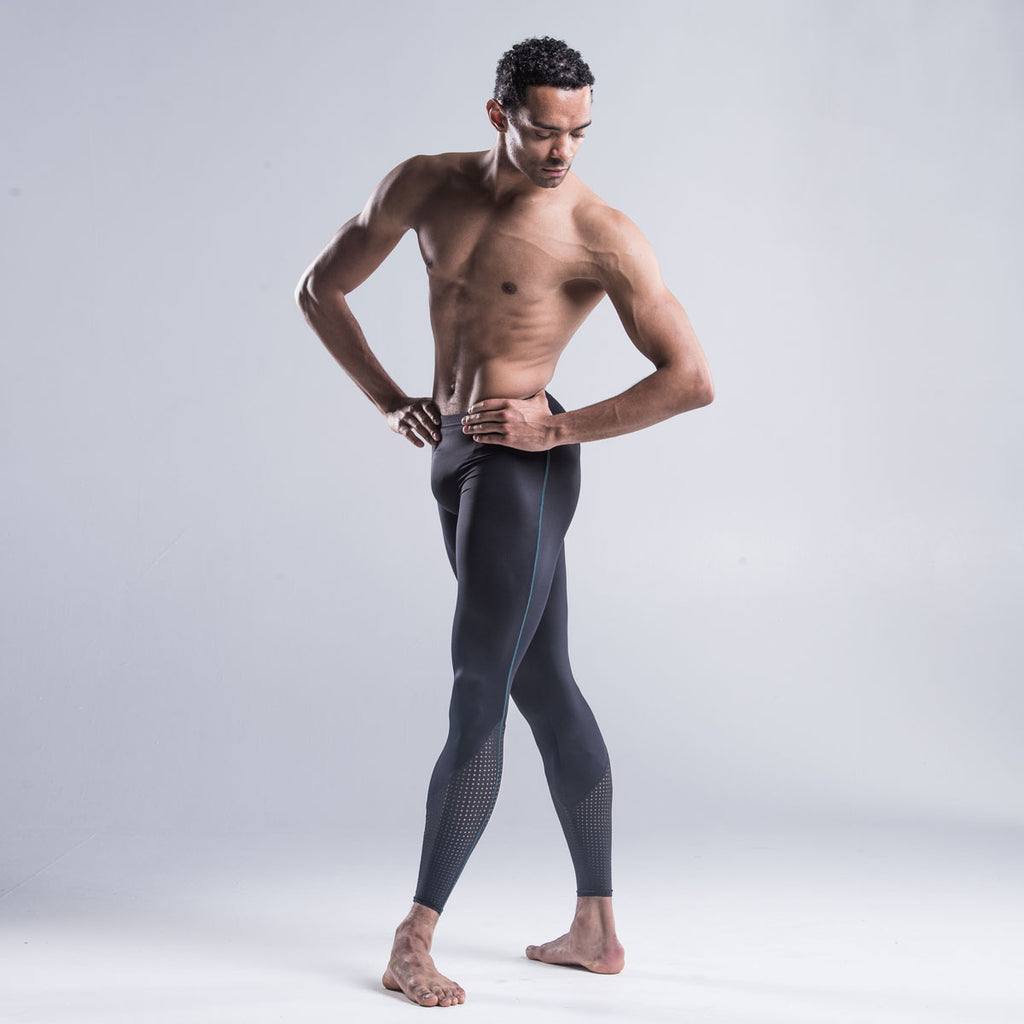 Brandon Lawrence wearing black dancer tights with a perforated bottom section highlights the calf muscle and extends the leg line combined The contrast green stitch down the side of the leg coordinates with other garments in the collection