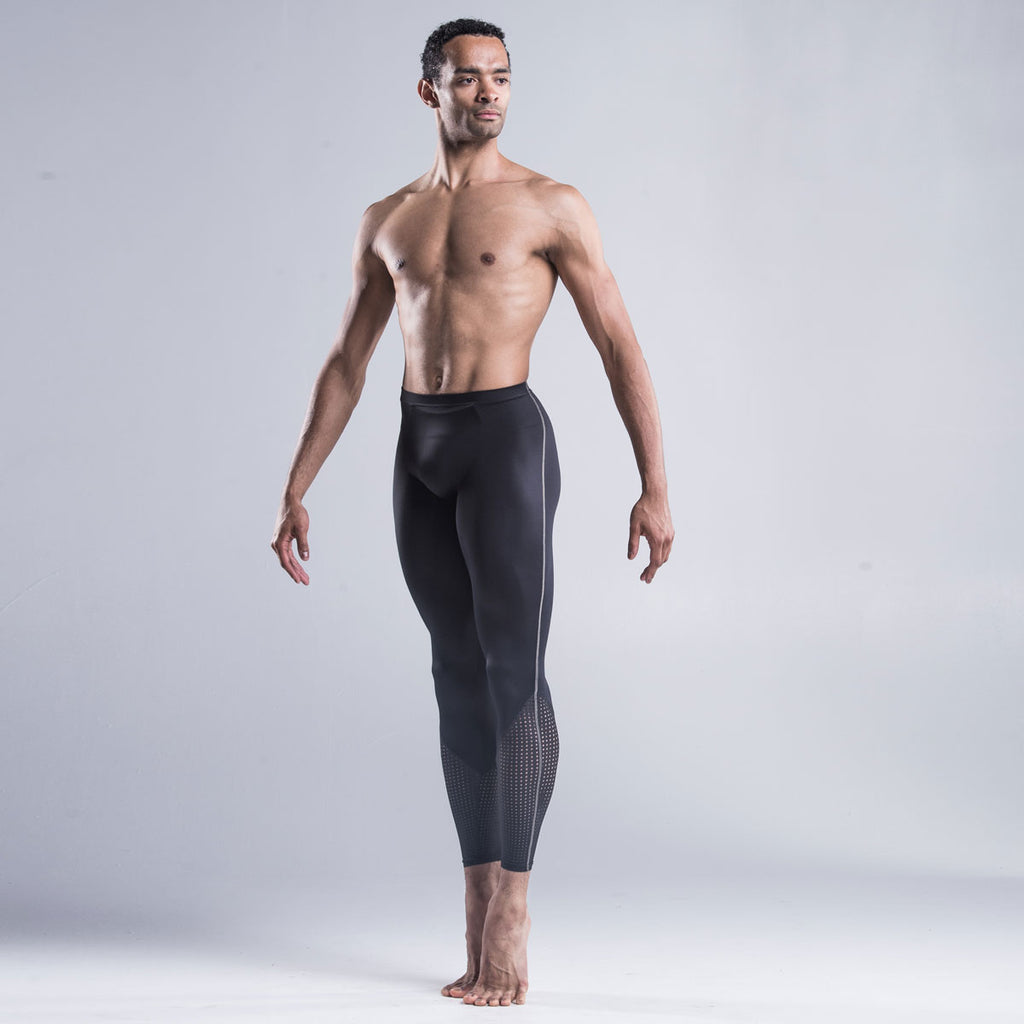 Brandon Lawrence wearing black dancer tights with a perforated bottom section highlights the calf muscle and extends the leg line combined The contrast stitch down the side of the leg coordinates with other garments in the collection